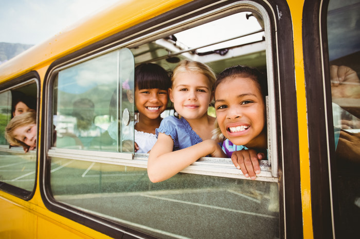 Children boarding a school bus