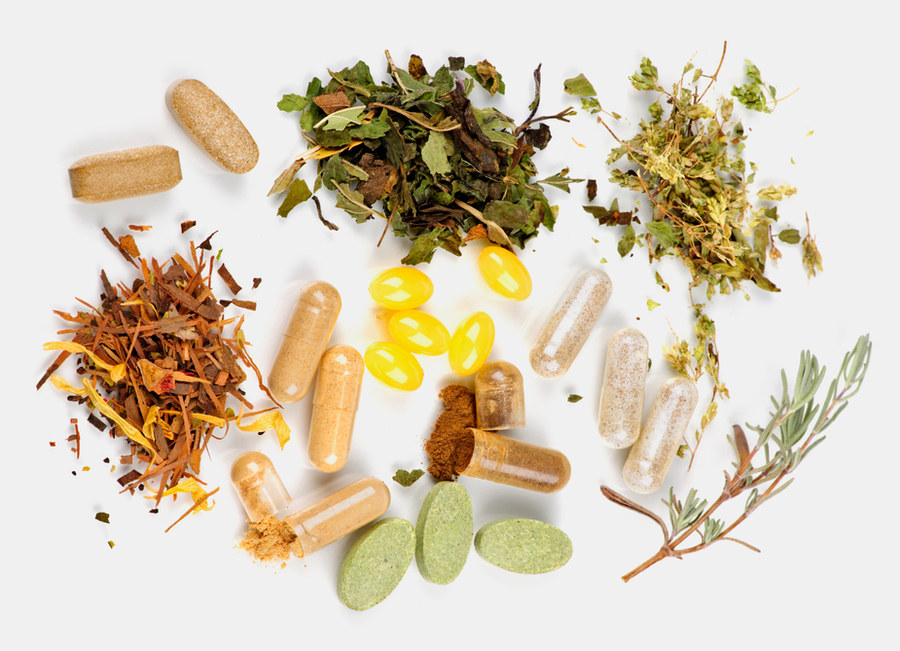 Herbs, supplements and minerals laid out on a surface