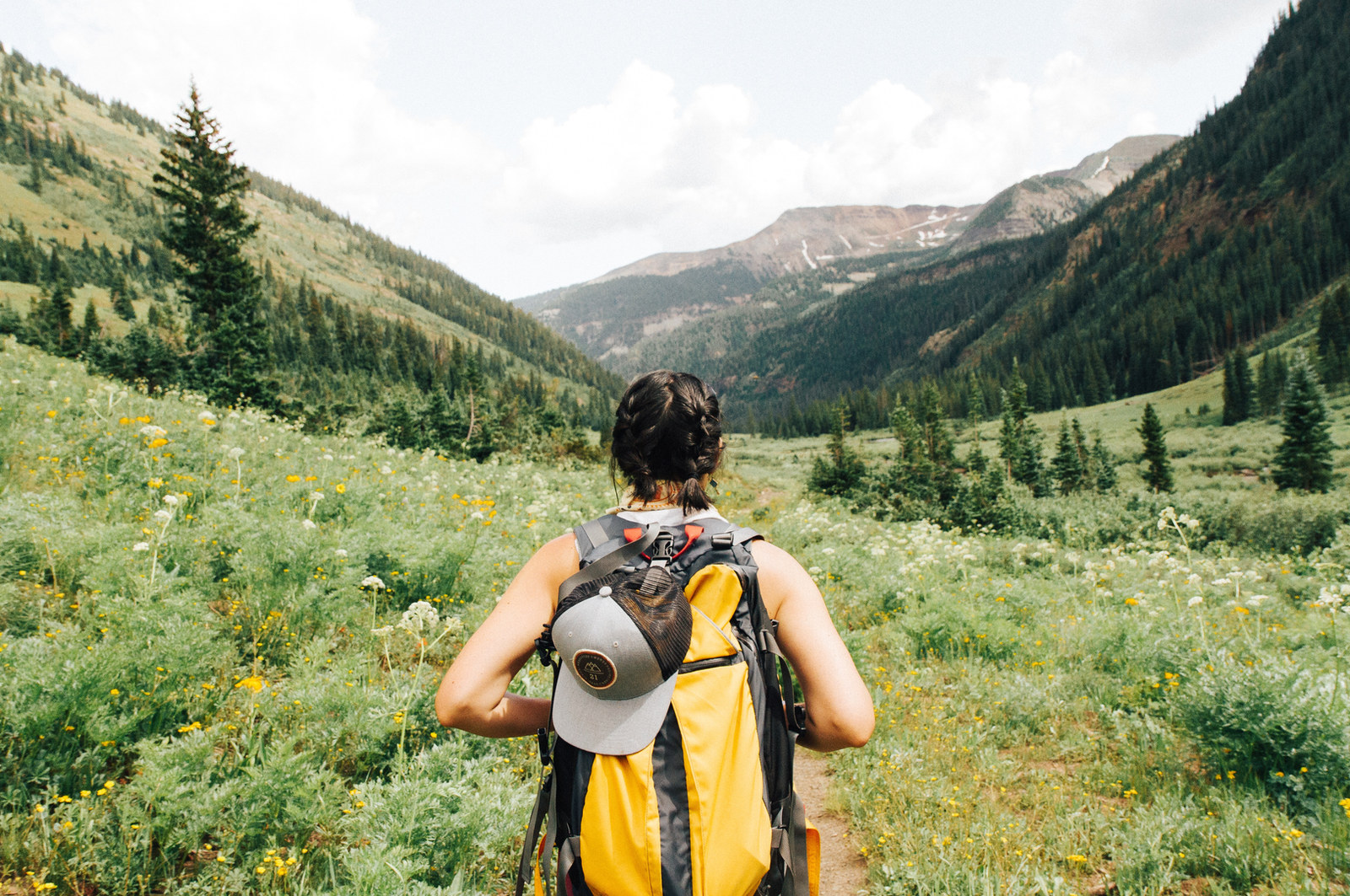 A hiker looking out over a mountain range