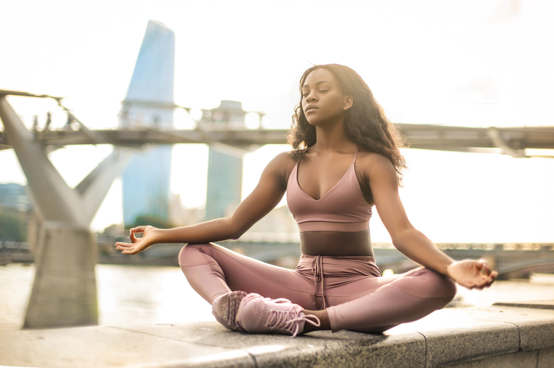 A person meditating outdoors